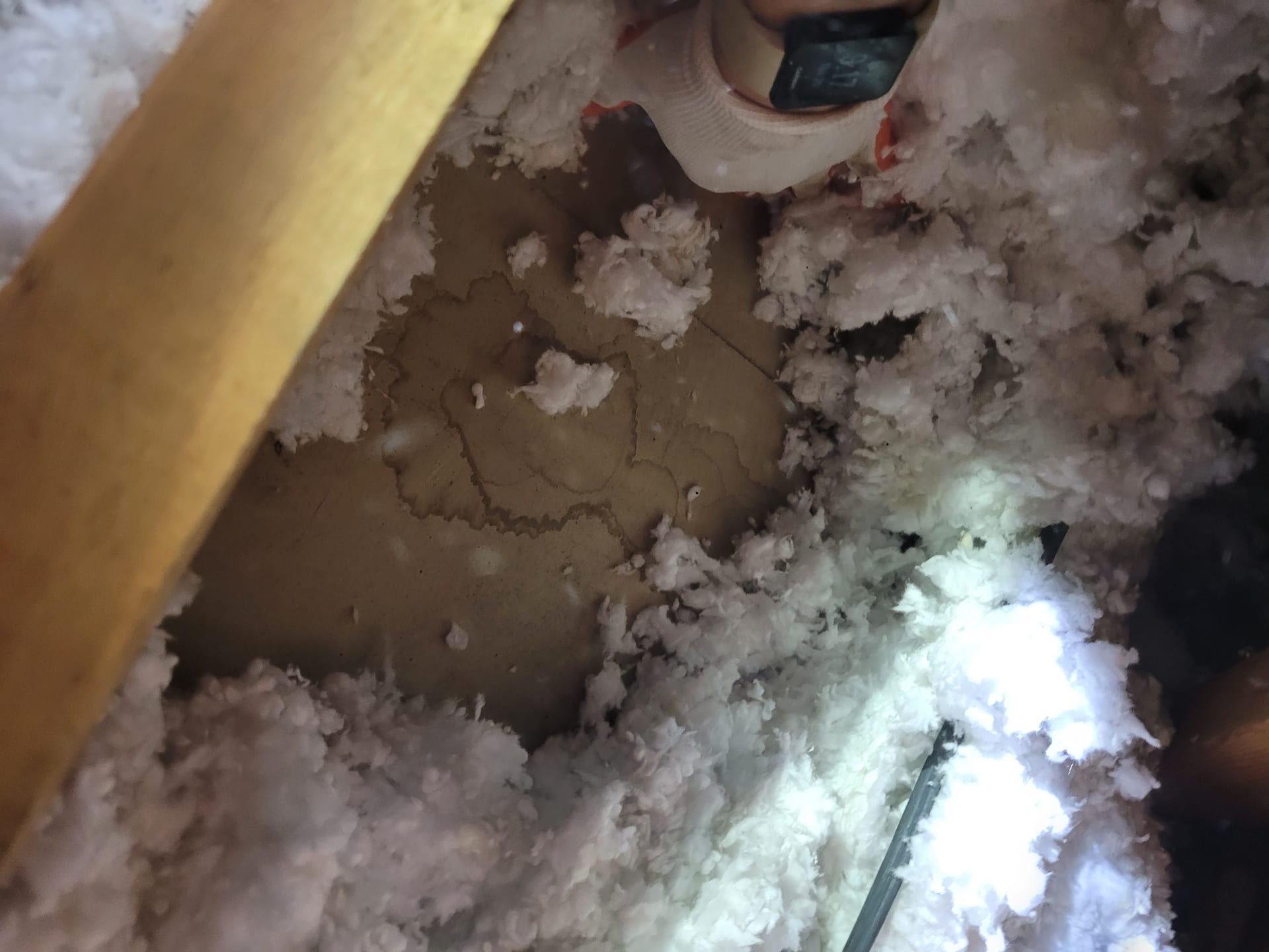 Removing water-stained wet fiberglass insulation