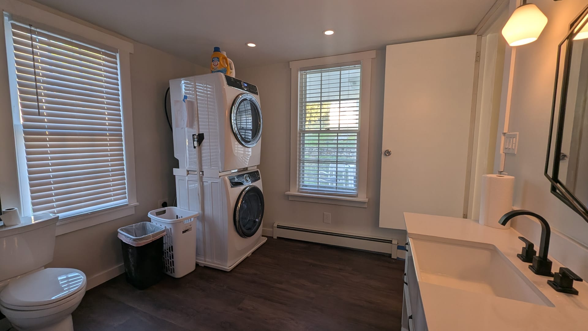 Utility & Bath Reconstruction — Integrated laundry and bath space restored with durable, moisture-hardened materials.